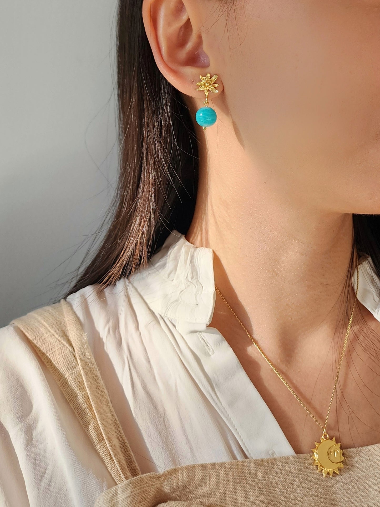 Amazonite flower earrings worn on model to show scale and size. Handmade and sculpted using lost wax technique in 18k gold vermeil. Styled with 20k gold plated astrology sign necklace.